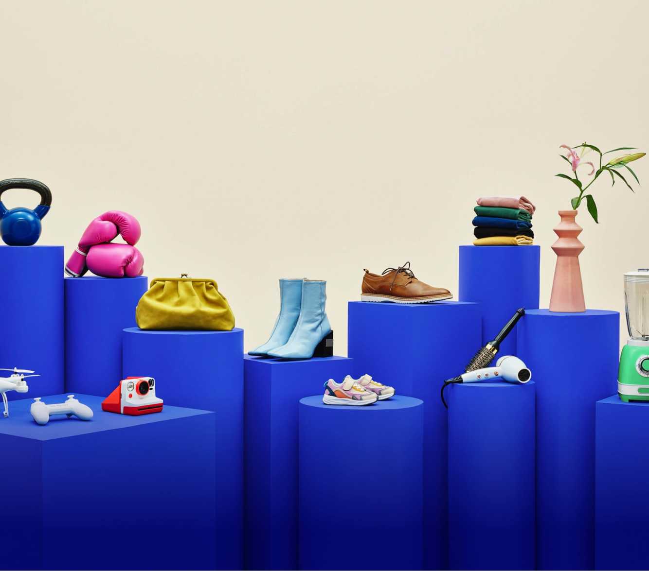 image of shoes and various objects on blue pedestals
